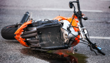 orange motorcycle on the ground